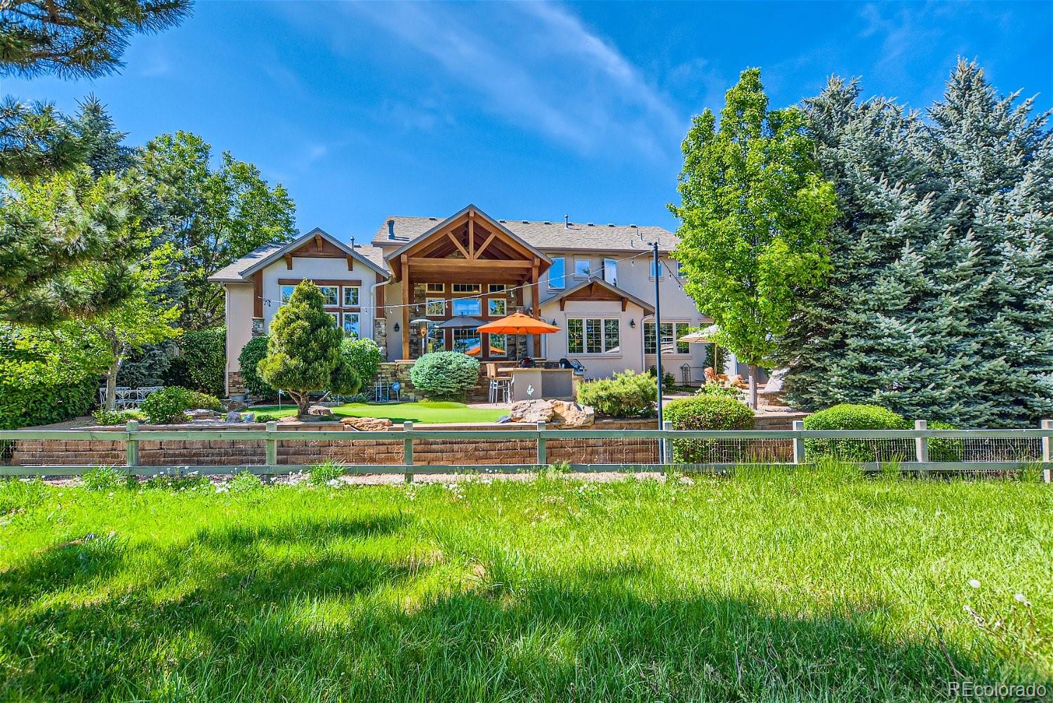 722 Skywalker Point Lafayette, CO 80026 - Photo 34 of 47 a view of house with a big yard and large trees