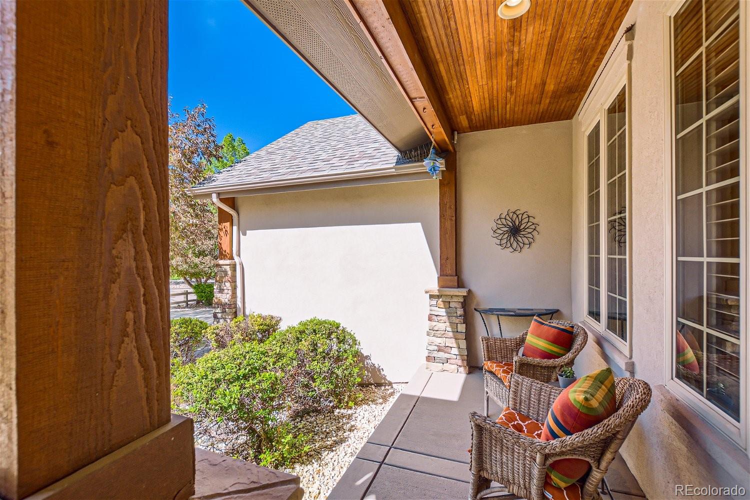 722 Skywalker Point Lafayette, CO 80026 - Photo 4 of 47 a balcony with table and chairs