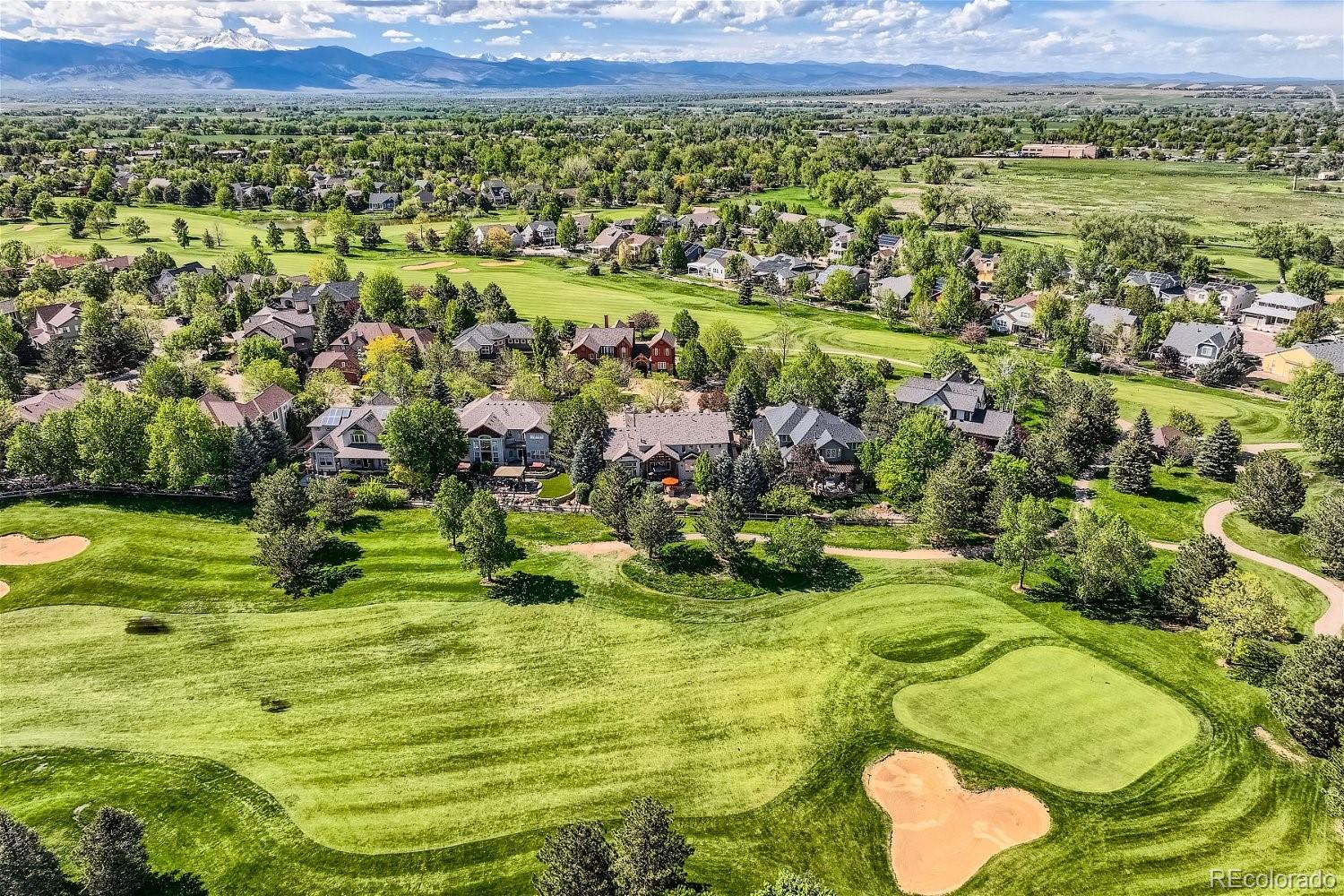 722 Skywalker Point Lafayette, CO 80026 - Photo 41 of 47 a view of a golf course with a lake