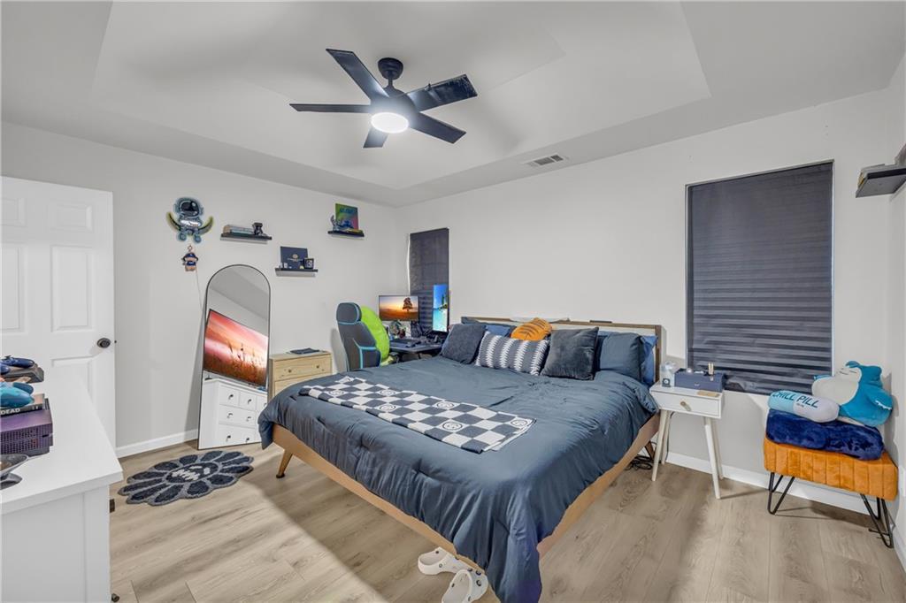 624 Red Fox Lane Auburn, GA 30011 - Photo 12 of 28 a living room with furniture a rug and a chandelier