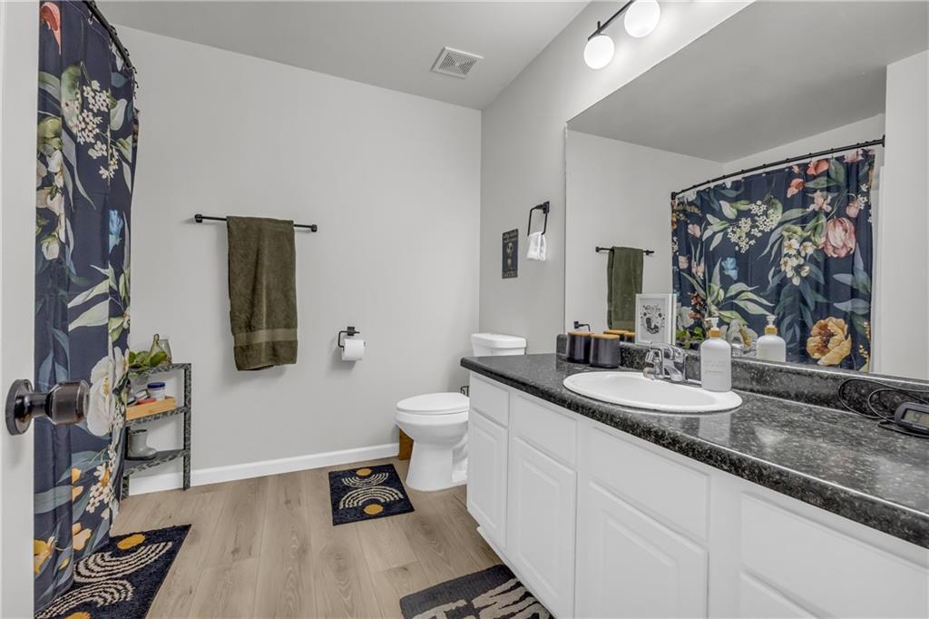 624 Red Fox Lane Auburn, GA 30011 - Photo 15 of 28 a bathroom with a granite countertop sink and a mirror