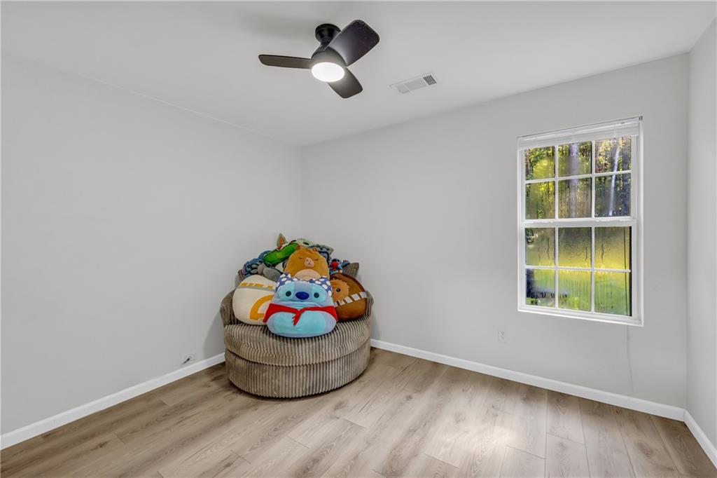 624 Red Fox Lane Auburn, GA 30011 - Photo 17 of 28 a room with toys and wooden floor