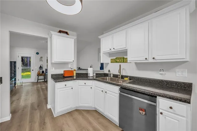 a kitchen with a sink and cabinets
