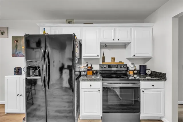 a kitchen with stainless steel appliances a stove and a refrigerator