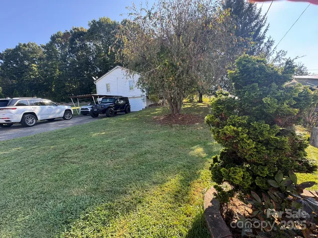 a view of a house with a back yard
