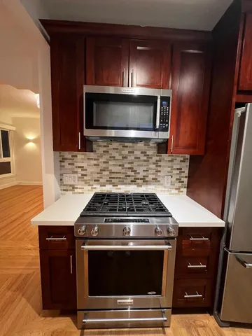 a kitchen with a stove and a microwave