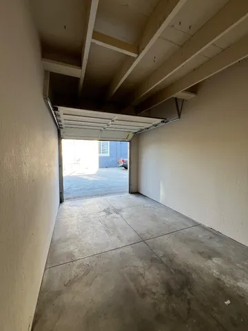 a view of a street with houses on both side
