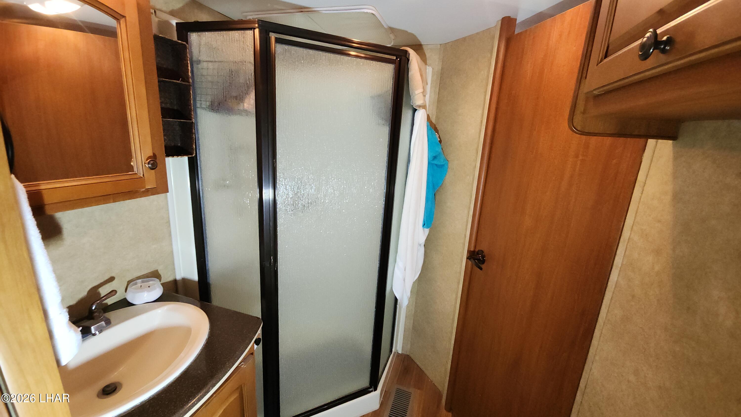 33 North Juniper Road Quartzsite, AZ 85346 - Photo 25 of 40 a bathroom with a sink and a mirror