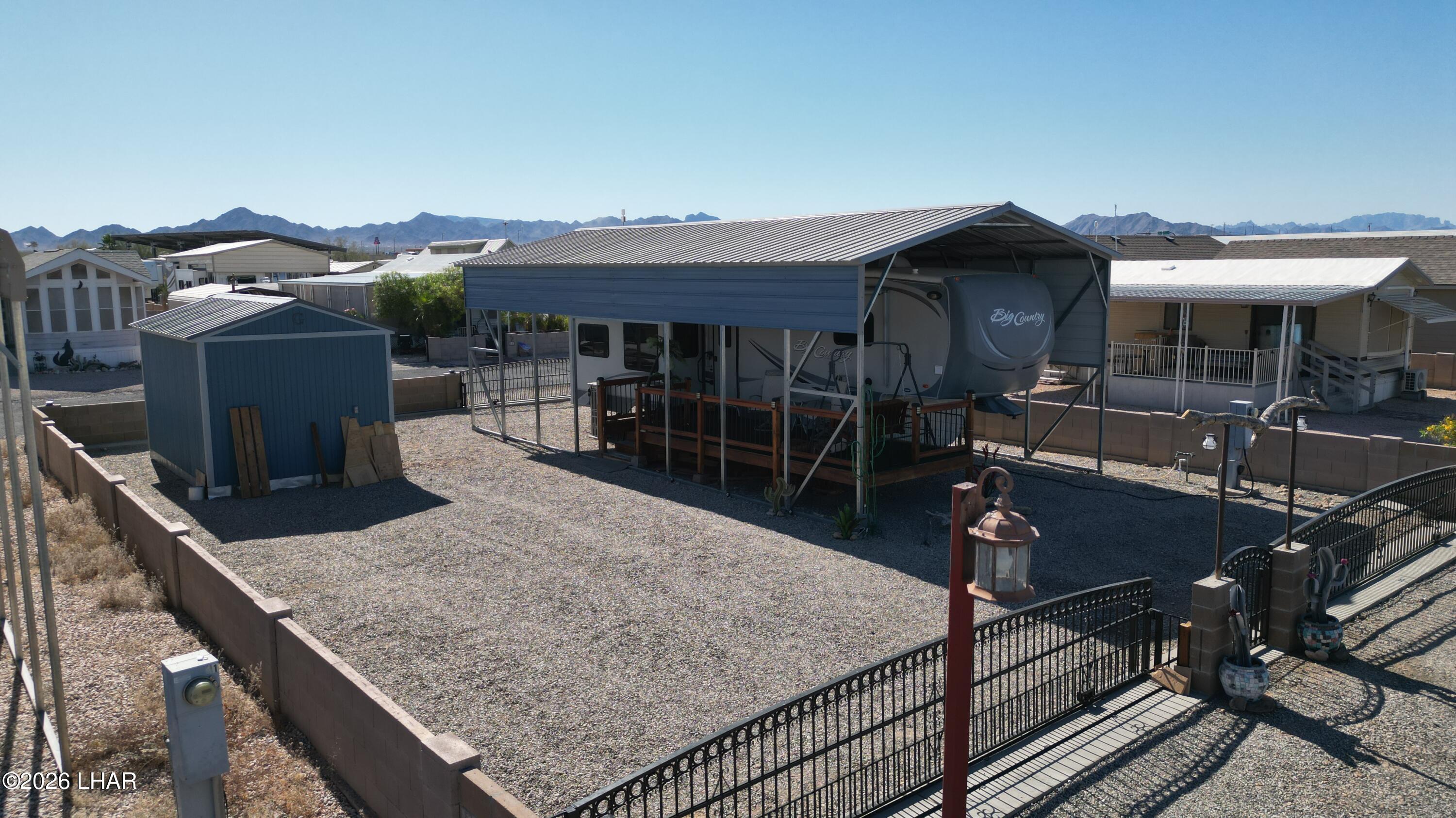 33 North Juniper Road Quartzsite, AZ 85346 - Photo 34 of 40 a view of a house with backyard and sitting area