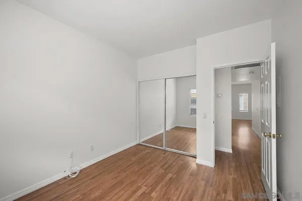 a view of wooden floor in an empty room