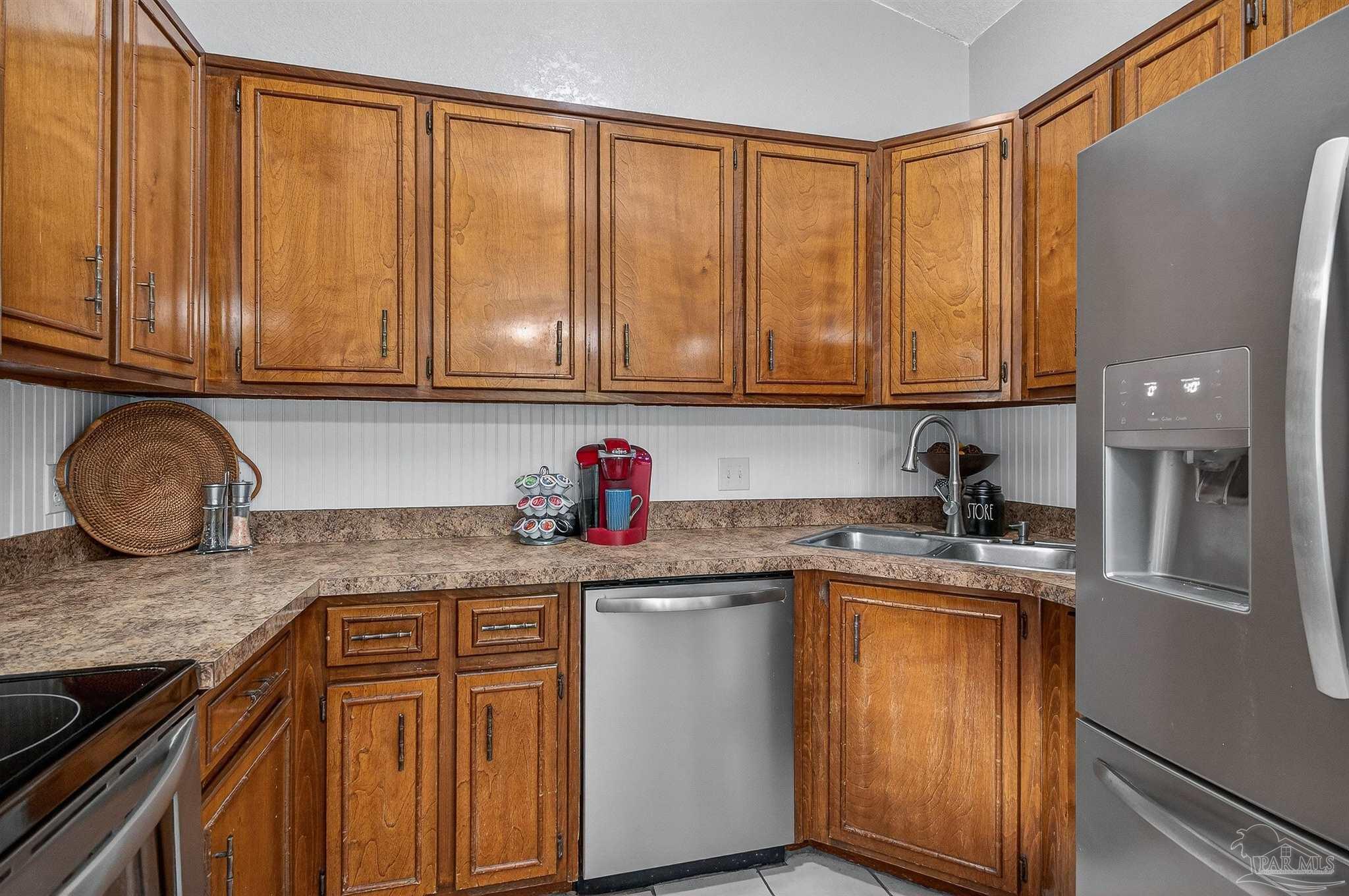 4807 Jennifer Lane Pace, FL 32571 - Photo 14 of 49 a kitchen with granite countertop cabinets and window