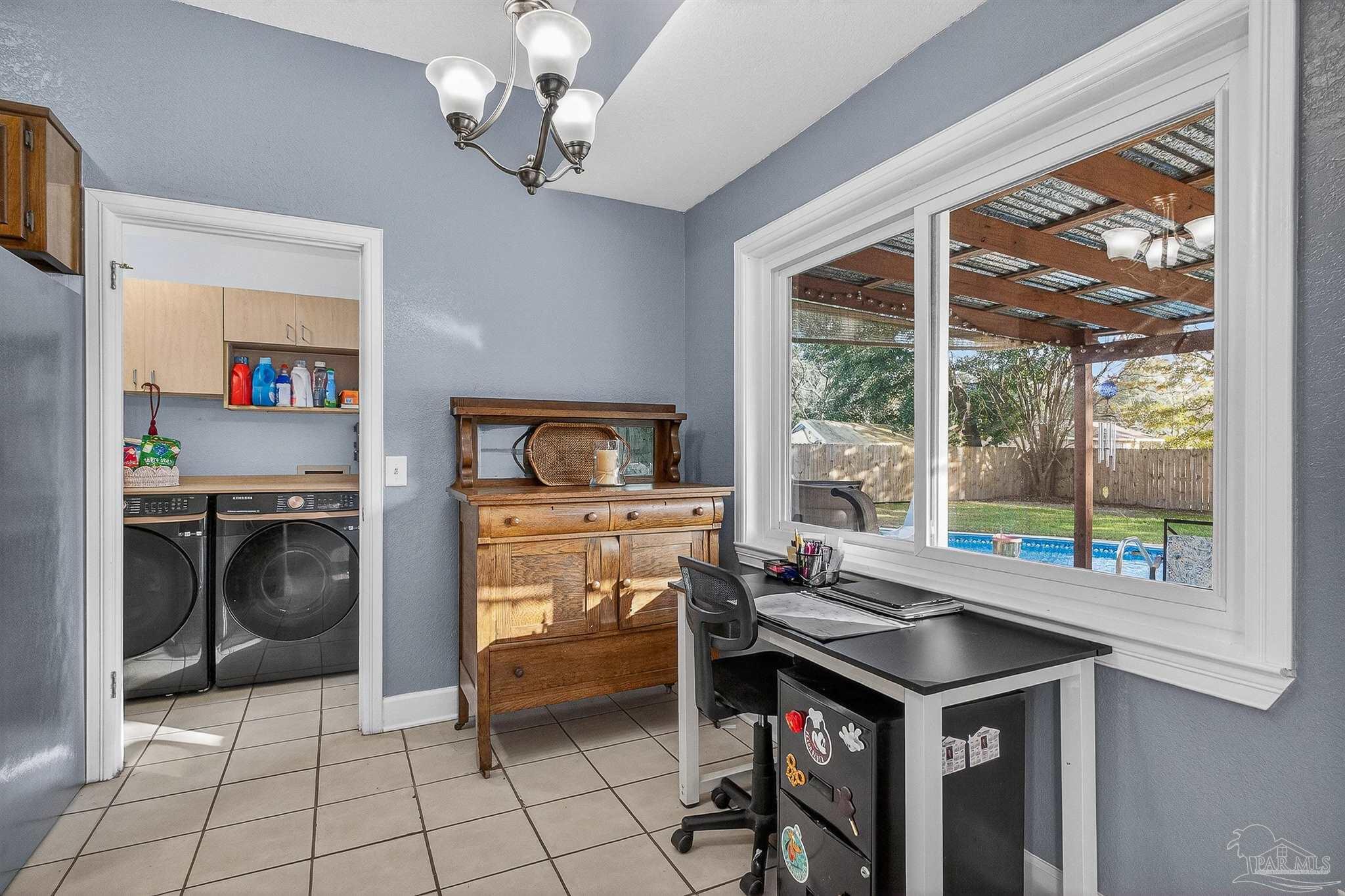 4807 Jennifer Lane Pace, FL 32571 - Photo 17 of 49 a kitchen with a stove a sink and a microwave