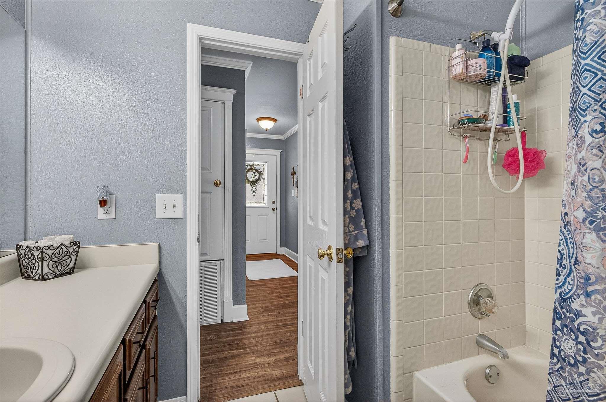 4807 Jennifer Lane Pace, FL 32571 - Photo 27 of 49 a bathroom with a tub shower and sink