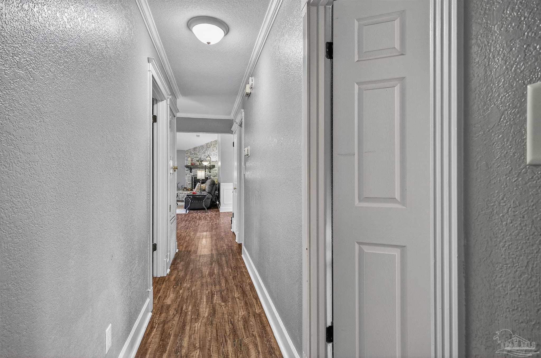 4807 Jennifer Lane Pace, FL 32571 - Photo 31 of 49 a view of a hallway with wooden floor and staircase