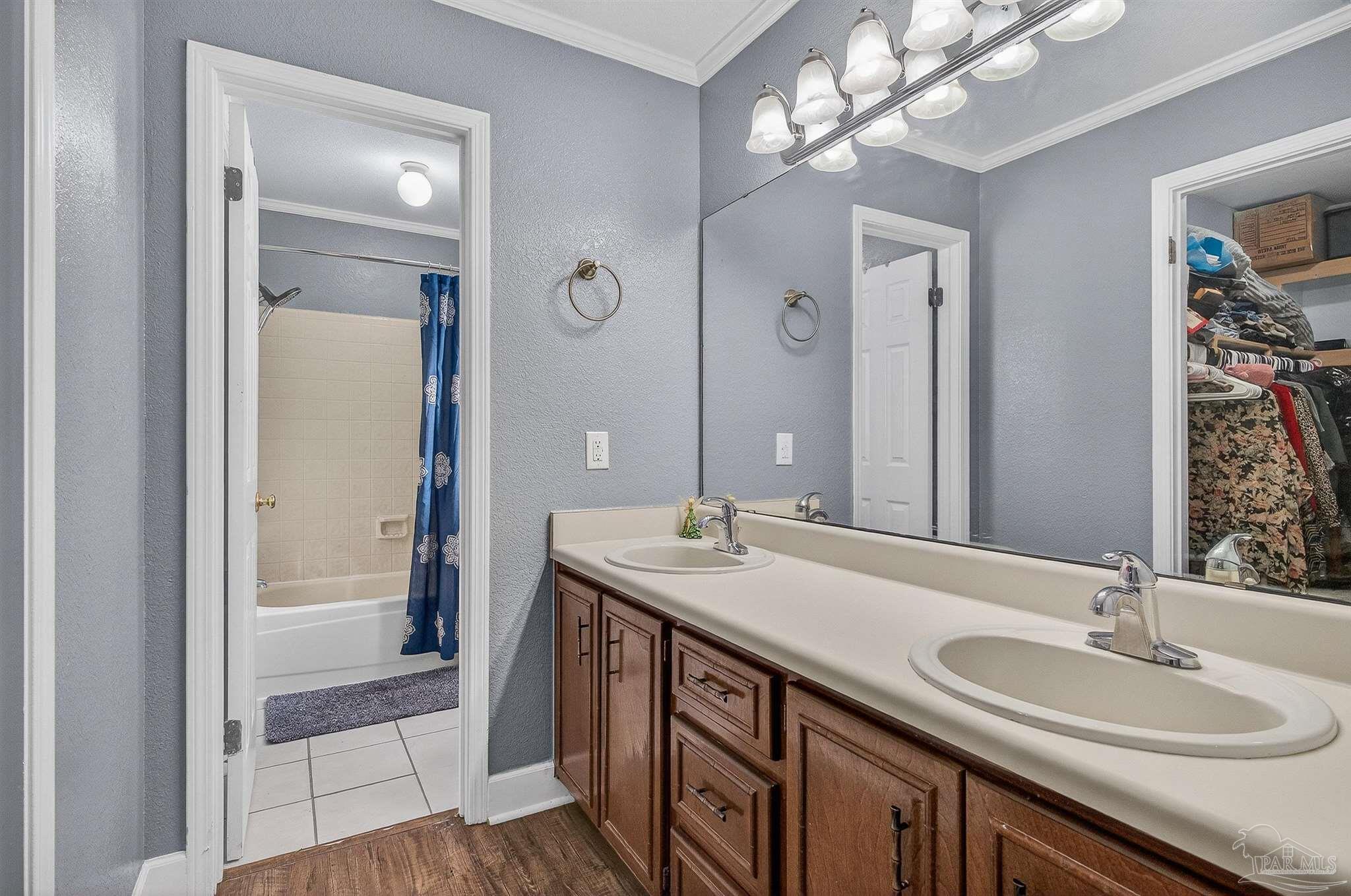 4807 Jennifer Lane Pace, FL 32571 - Photo 35 of 49 a bathroom with a sink double vanity and a mirror
