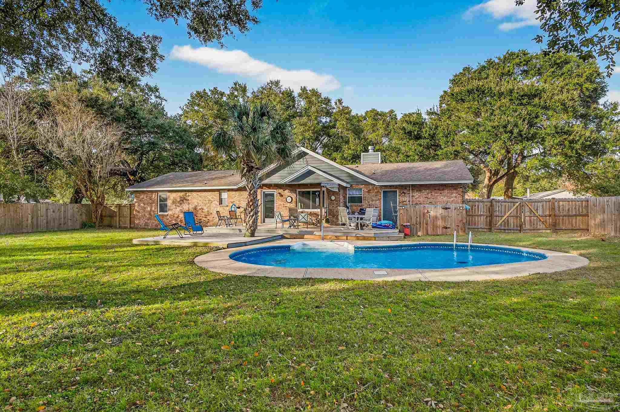 4807 Jennifer Lane Pace, FL 32571 - Photo 42 of 49 a front view of house with outdoor space and swimming pool