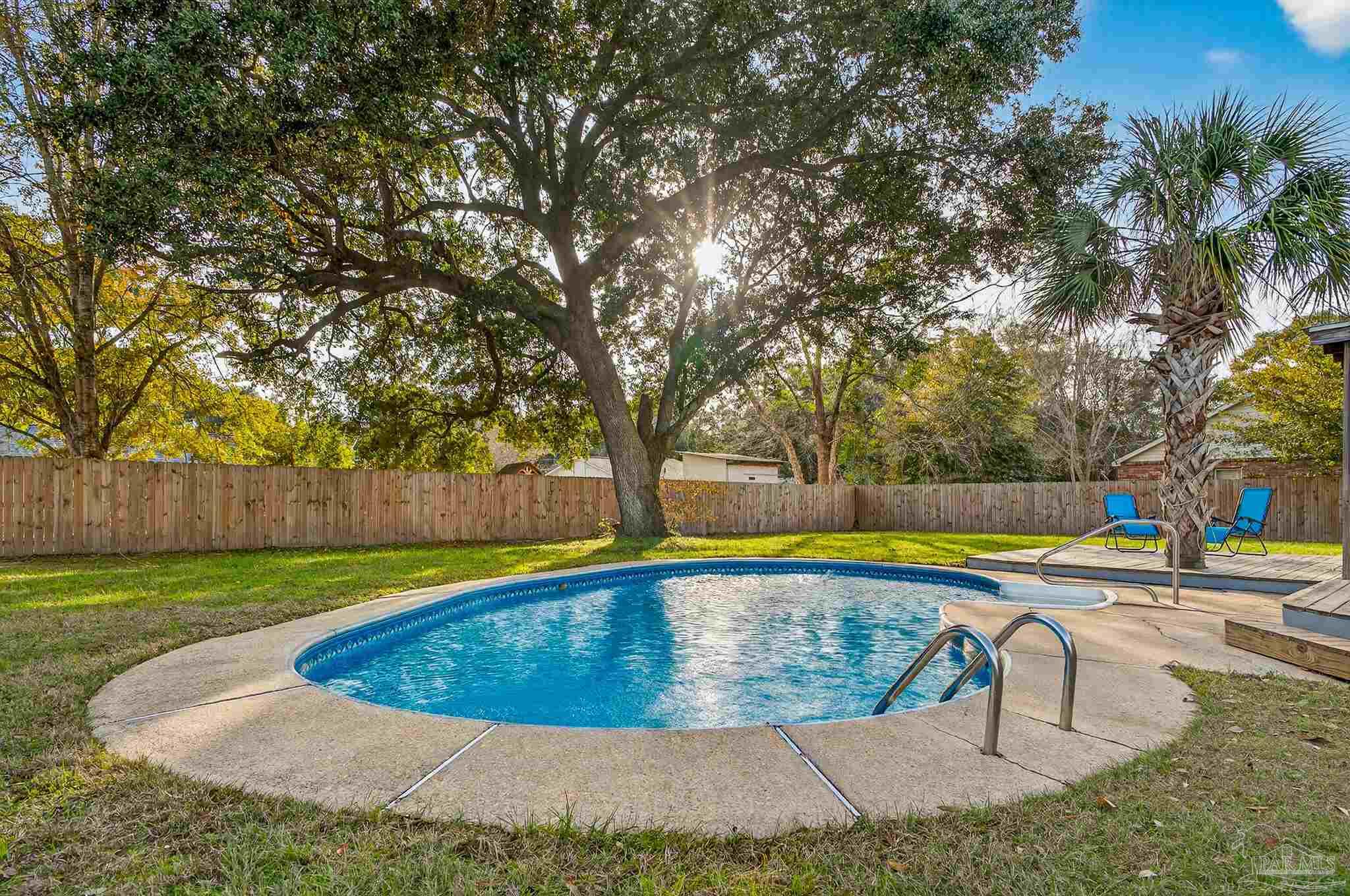 4807 Jennifer Lane Pace, FL 32571 - Photo 44 of 49 a view of a swimming pool with an outdoor space