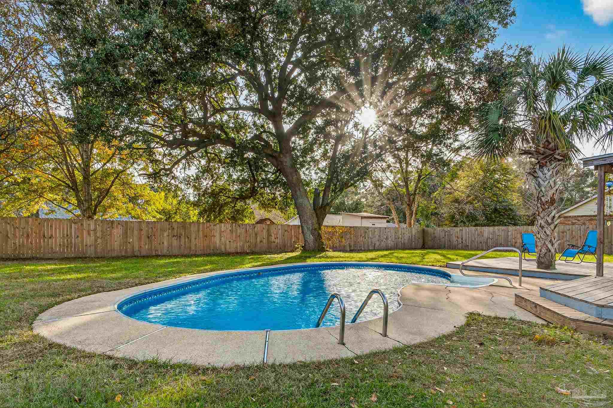 4807 Jennifer Lane Pace, FL 32571 - Photo 45 of 49 a view of a swimming pool with an outdoor space