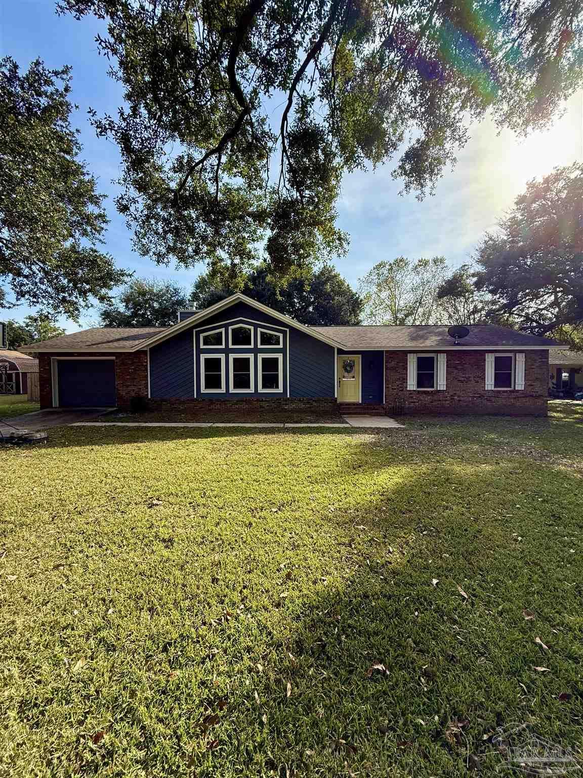 4807 Jennifer Lane Pace, FL 32571 - Photo 49 of 49 a view of a house with a backyard