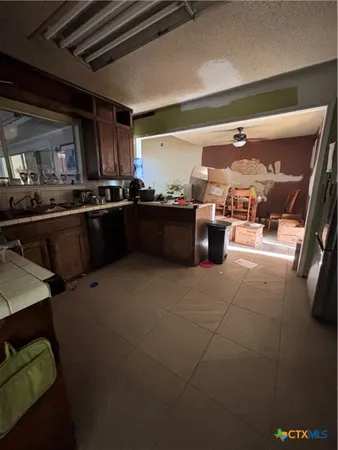 a dining room with furniture and a rug