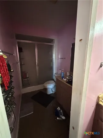 a bed room with a bed window and wall painting