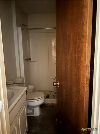 a view of a room with lots of gym equipment