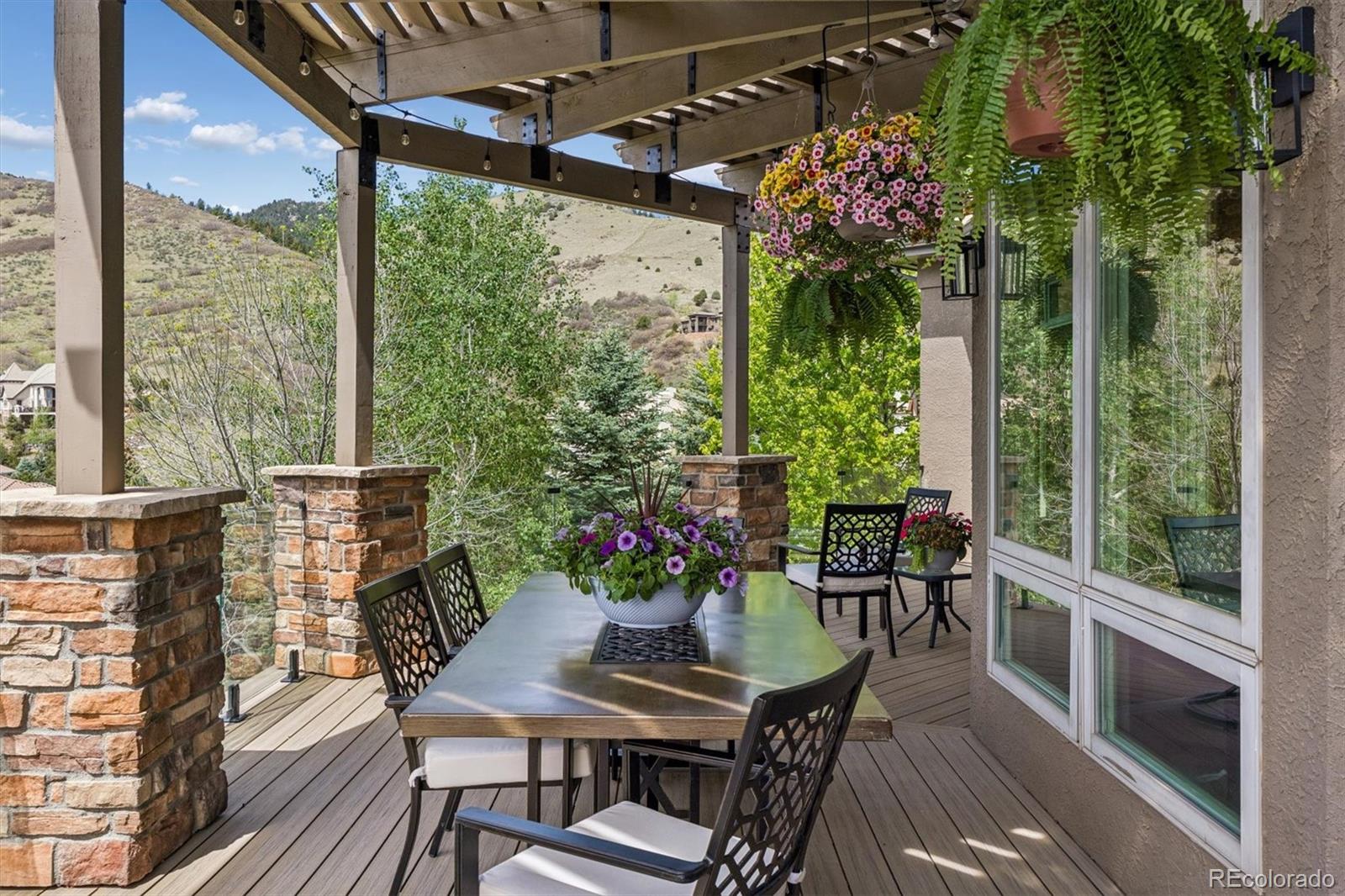 16422 Rocky Point Lane Morrison, CO 80465 - Photo 13 of 50 a view of a dining room with furniture window and outside view