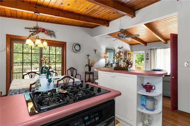 a kitchen with a stove and a table
