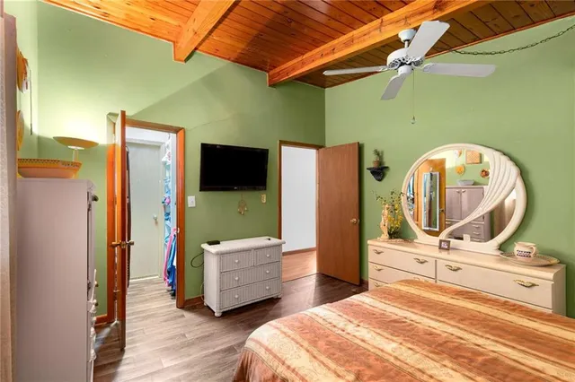 a bed room with a bed and a mirror