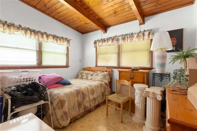 a bed room with two bed and a large window