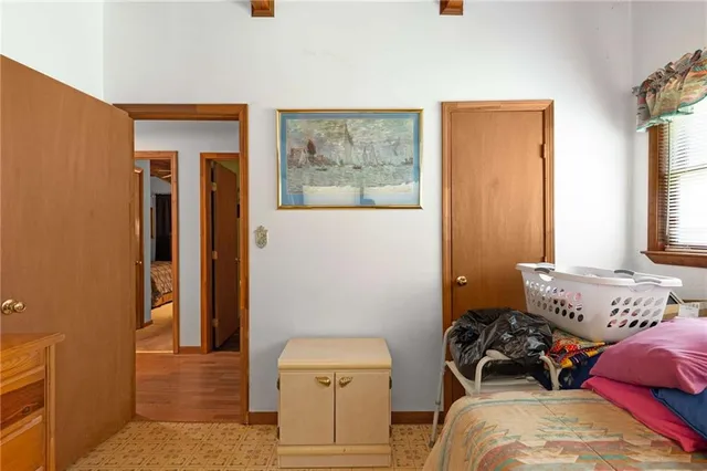 a bedroom with furniture and a window