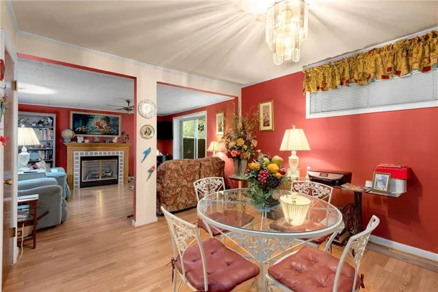 a dining room with furniture and wooden floor
