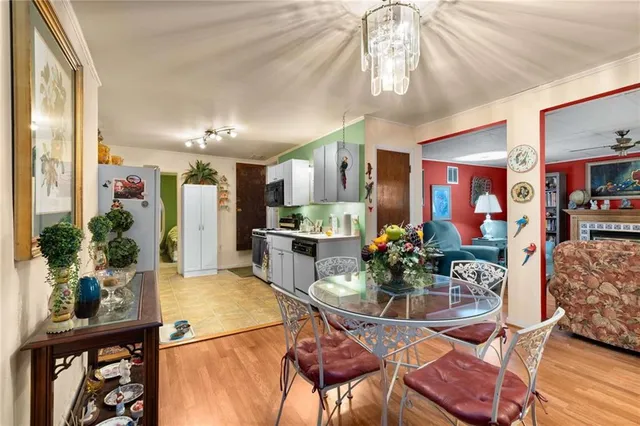 a dining room with furniture and window