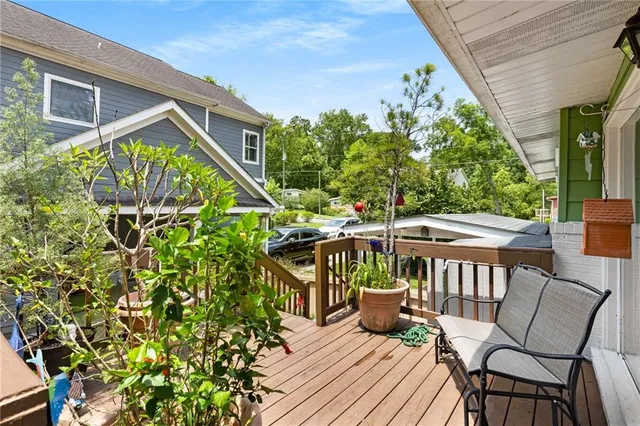 a view of a patio with table and chairs and potted plants
