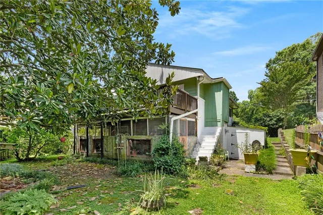 a backyard of a house with lots of green space