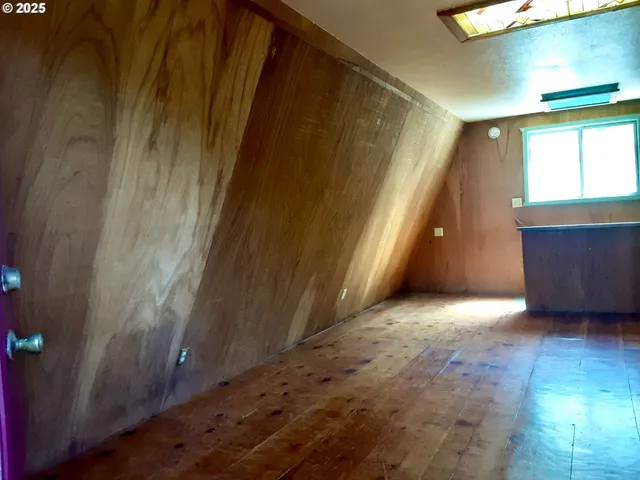 a balcony with wooden floor and fence