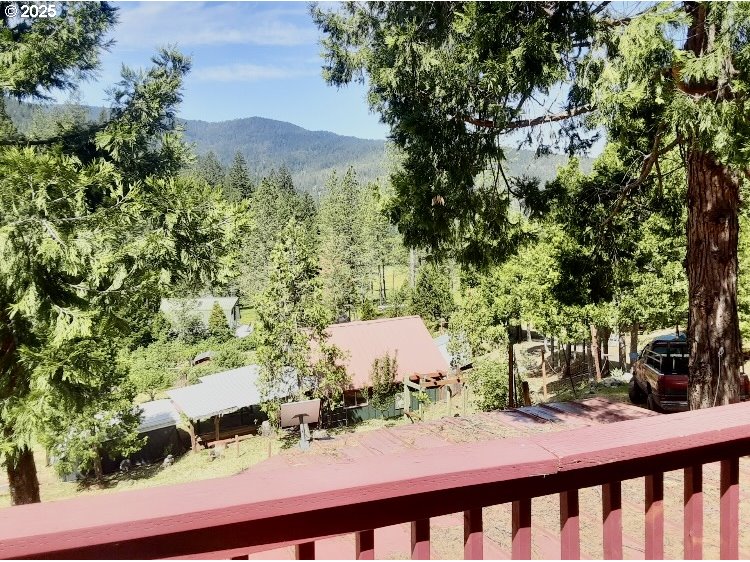 4580 Old House Creek Road Agness, OR 97406 - Photo 21 of 46 a view of a house with a yard