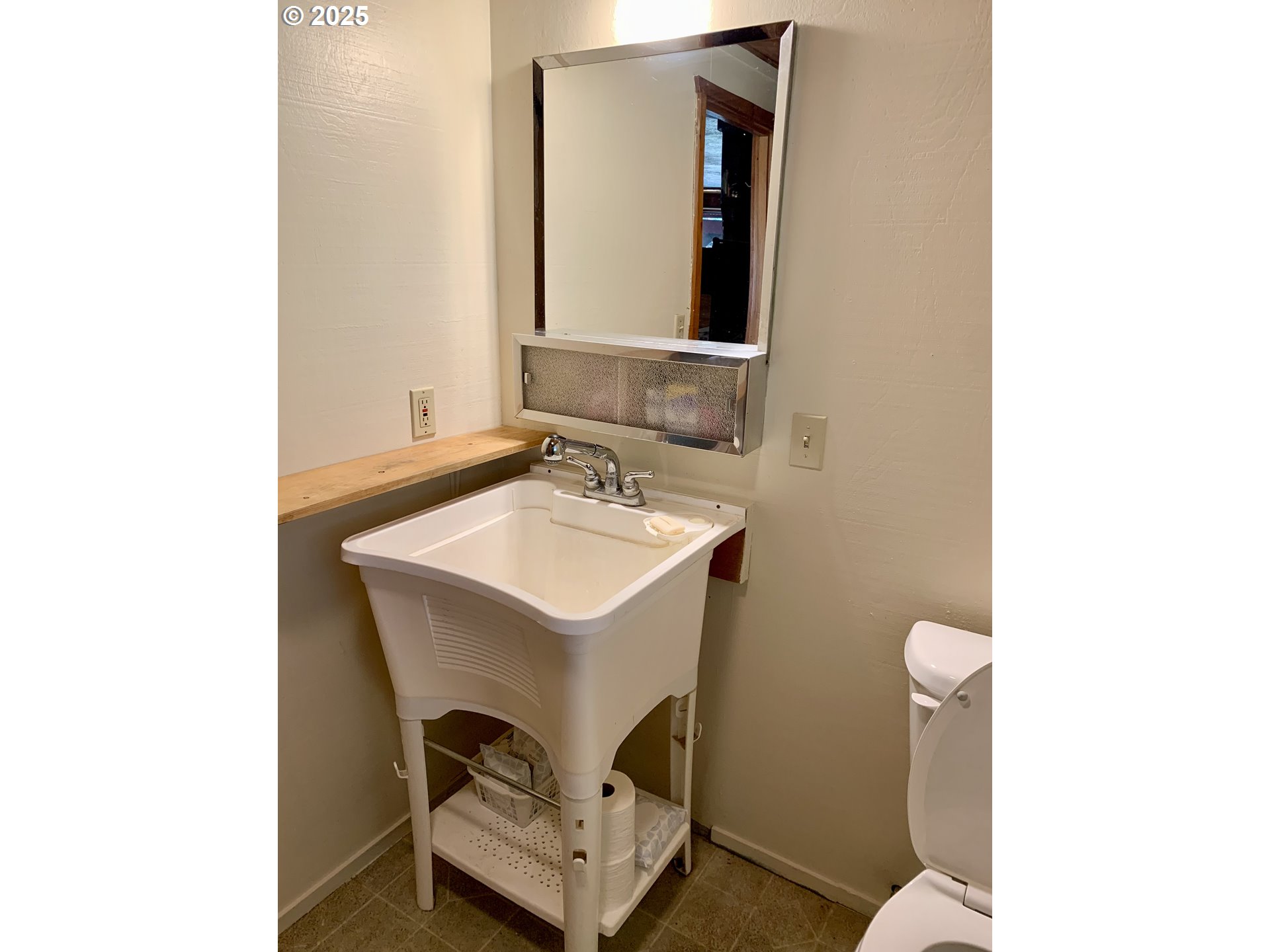 4580 Old House Creek Road Agness, OR 97406 - Photo 22 of 46 a bathroom with a sink and a mirror