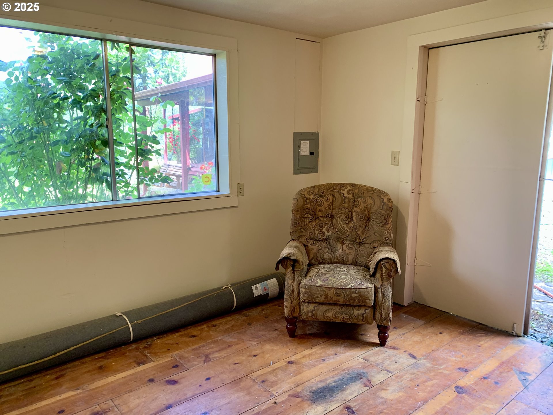 4580 Old House Creek Road Agness, OR 97406 - Photo 26 of 46 a living room with furniture and a window