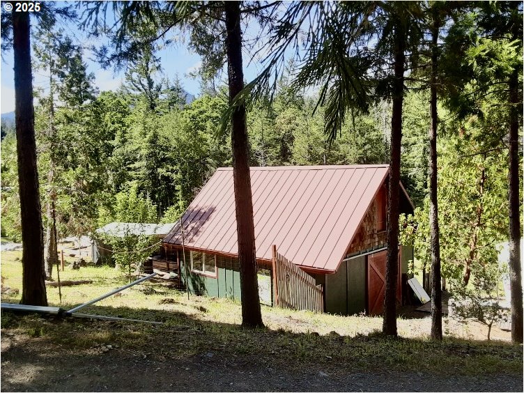 4580 Old House Creek Road Agness, OR 97406 - Photo 33 of 46 a view of a house with a yard