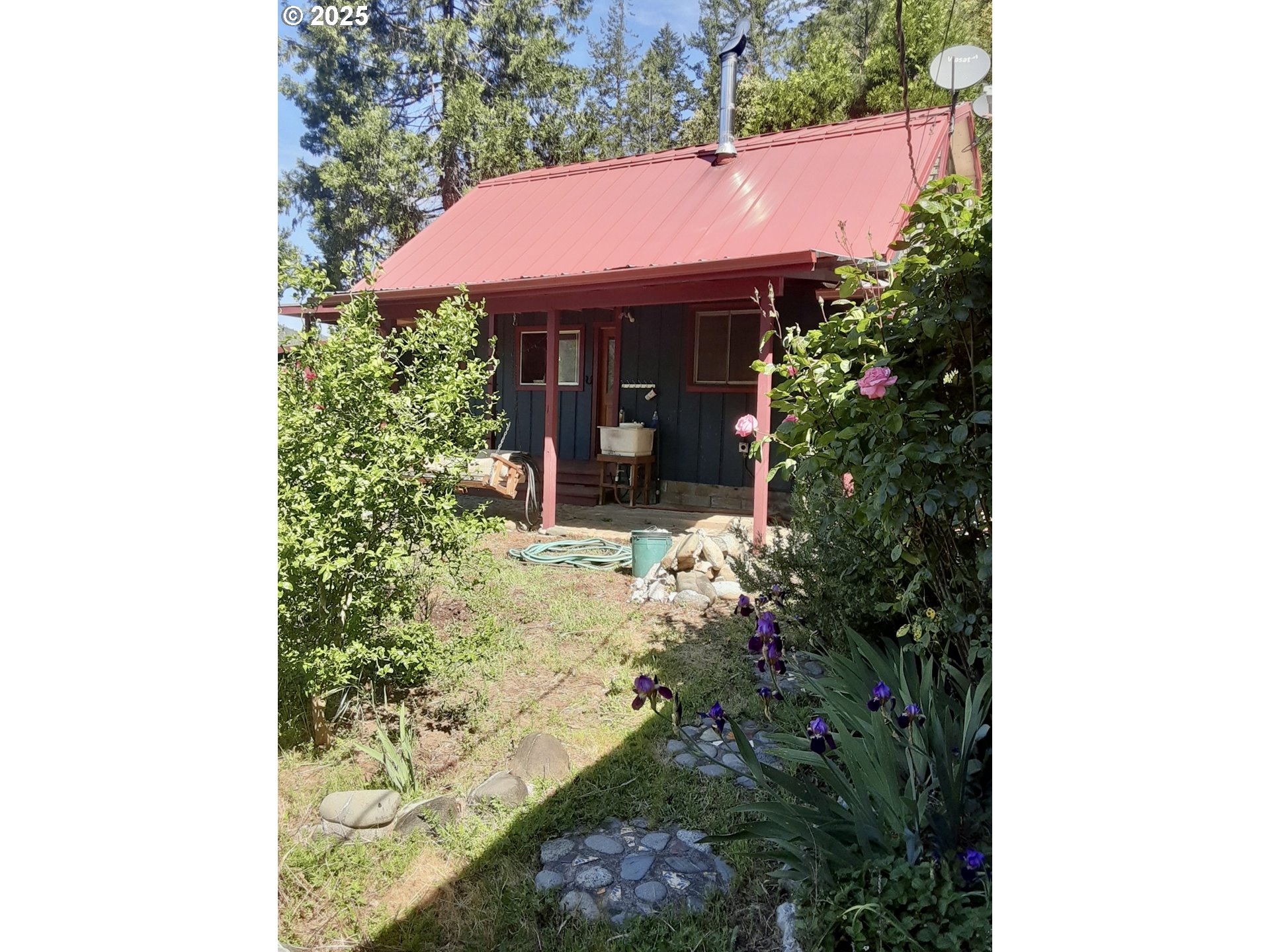 4580 Old House Creek Road Agness, OR 97406 - Photo 7 of 46 a view of a house with a garden