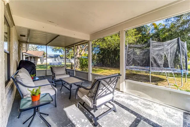 a view of swimming pool with outdoor seating
