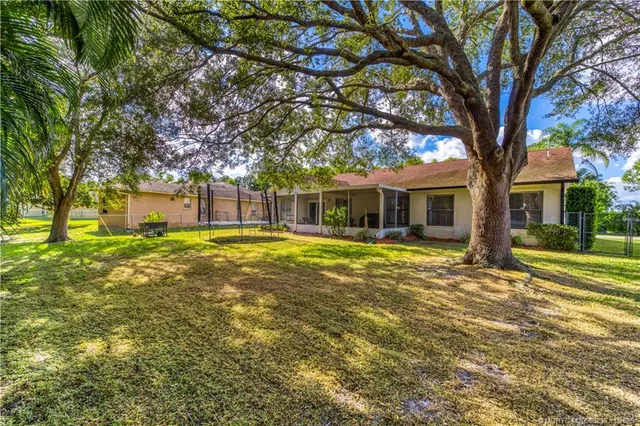 a house with swimming pool in front of it