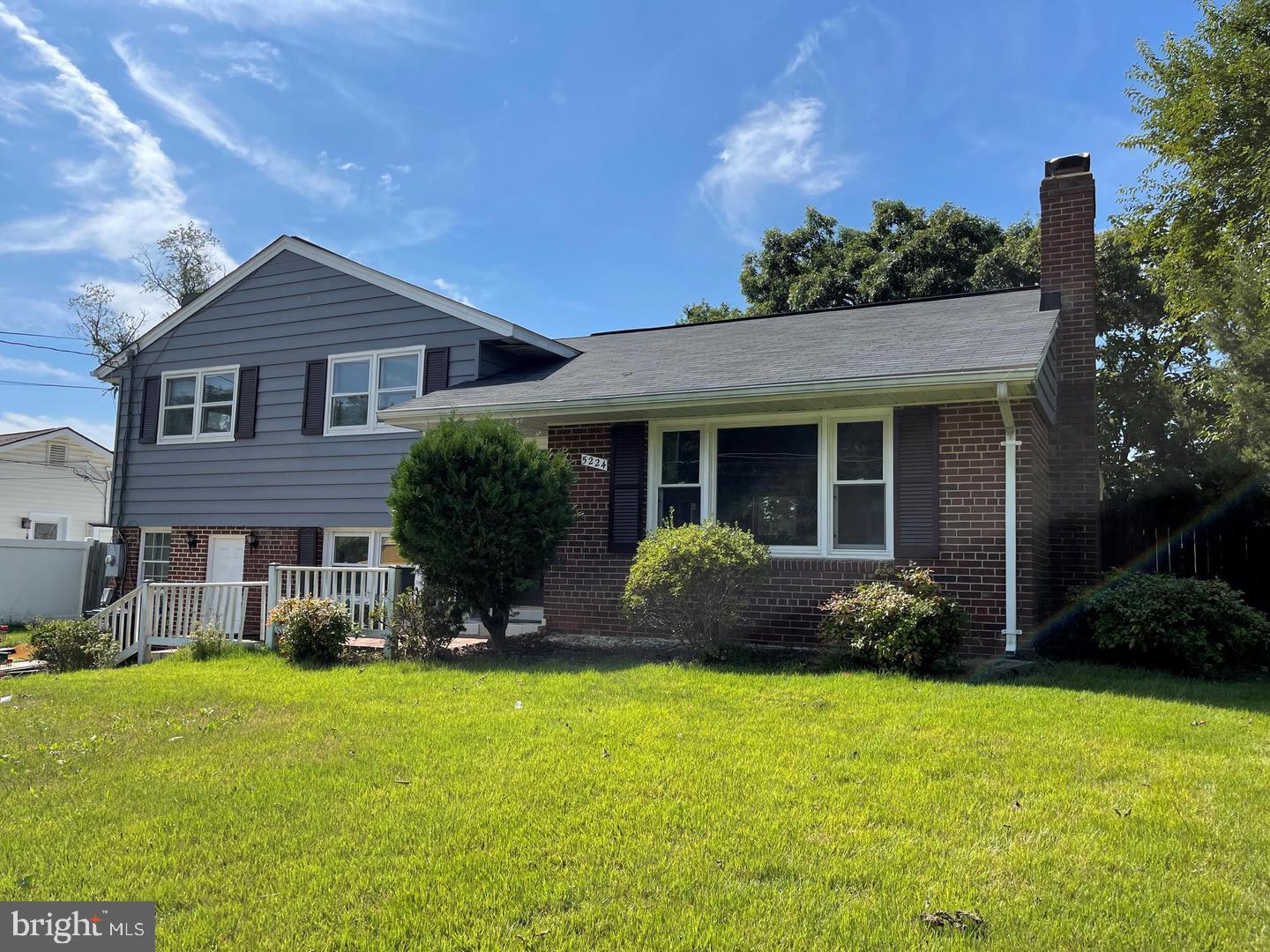5224 Forman Court Springfield, VA 22151 - Photo 1 of 16 a front view of a house with a garden