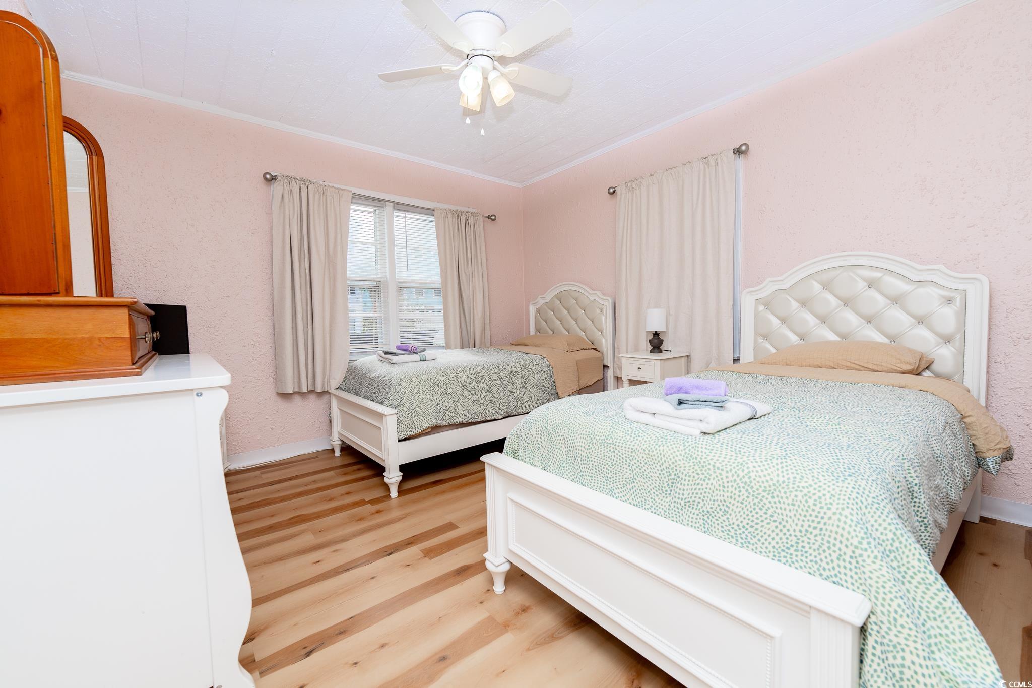 114 North Pinewood Drive Surfside Beach, SC 29575 - Photo 25 of 40 Bedroom featuring ceiling fan, light wood-type flooring, and ornamental molding