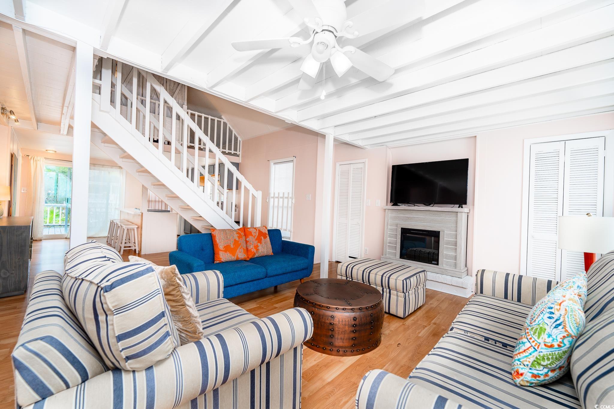 114 North Pinewood Drive Surfside Beach, SC 29575 - Photo 40 of 40 Living room with beam ceiling, light hardwood / wood-style flooring, and ceiling fan