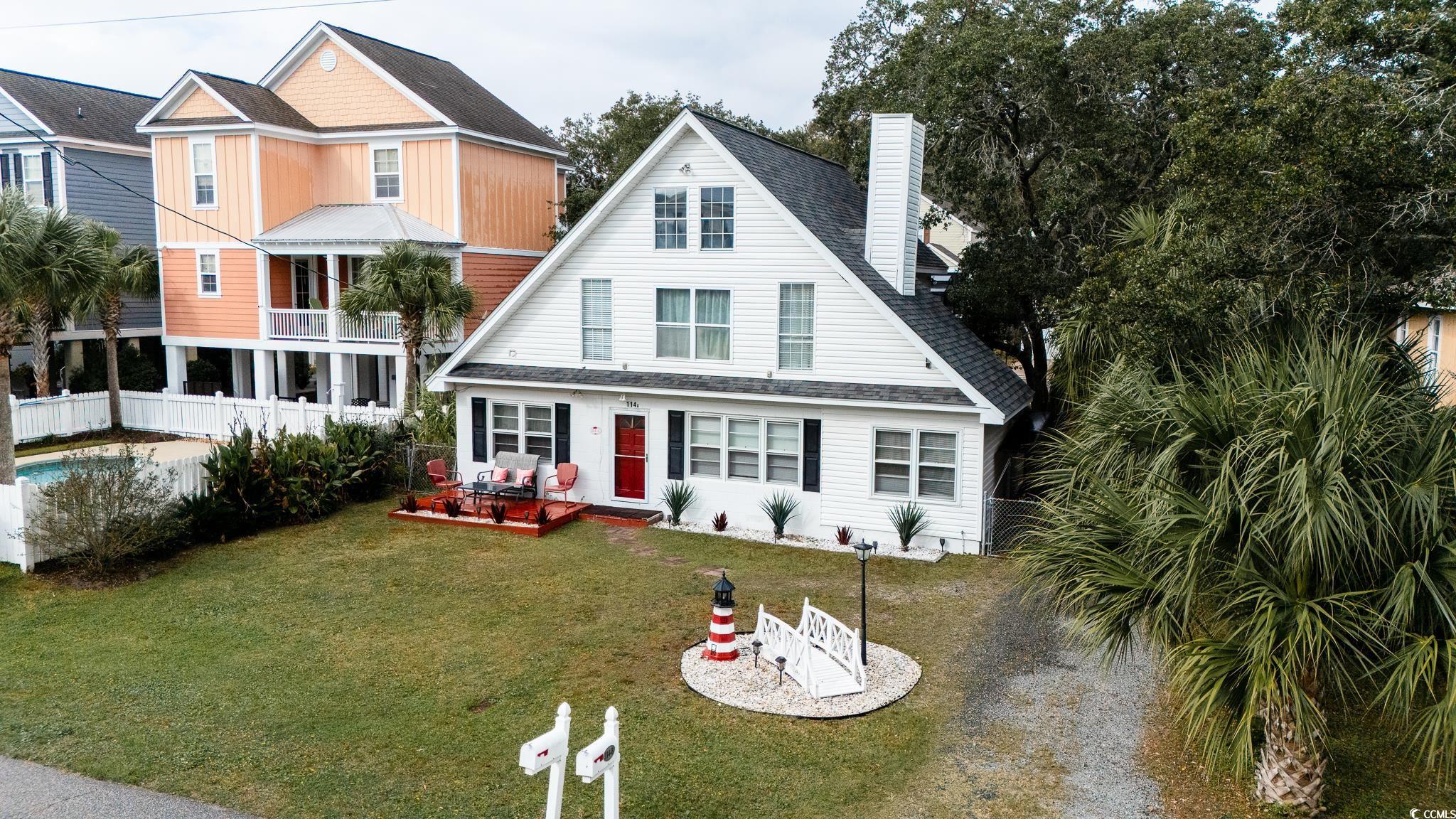 114 North Pinewood Drive Surfside Beach, SC 29575 - Photo 4 of 40 View of front of property with a front yard