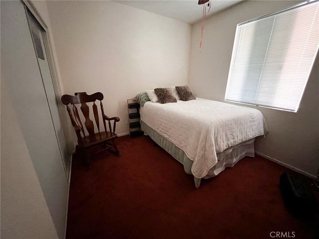 3857 Bella Torre Road Perris, CA 92571 - Photo 12 of 25 a bedroom with a bed and a window
