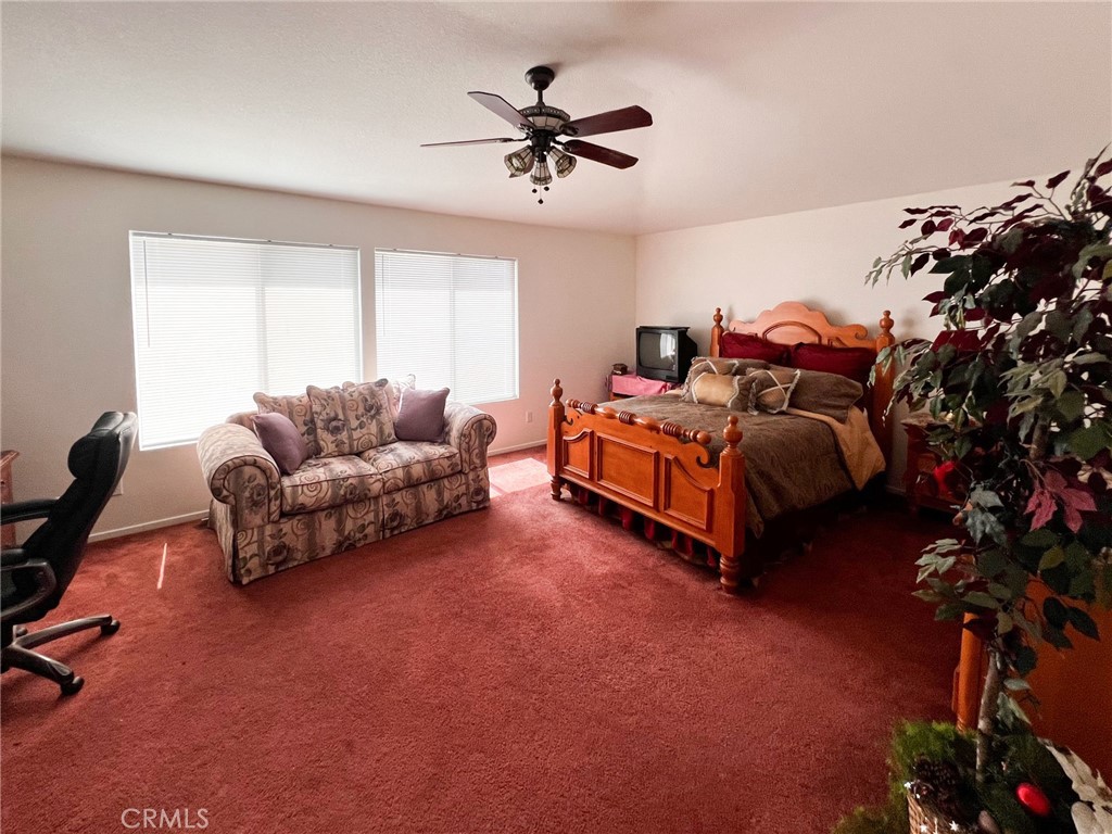 3857 Bella Torre Road Perris, CA 92571 - Photo 16 of 25 a living room with furniture and a chandelier