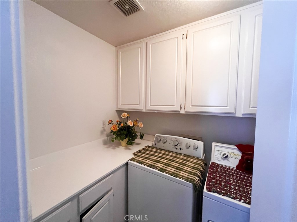 3857 Bella Torre Road Perris, CA 92571 - Photo 18 of 25 a room with a sink and cabinets
